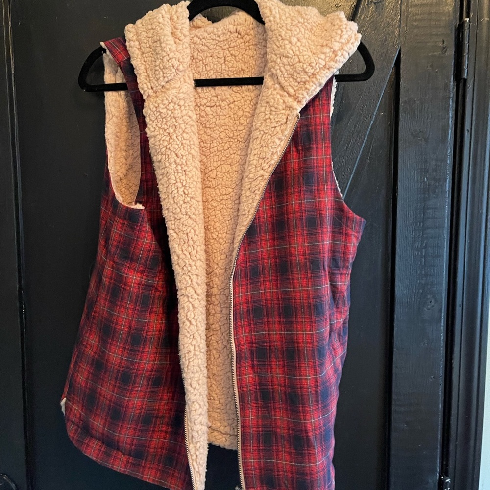 Boutique, reversible vest with hood.
